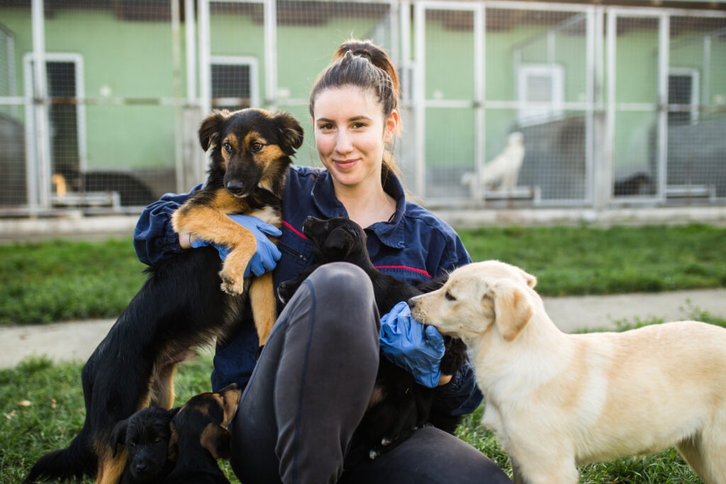 Animal-Shelter-Worker-with-Two-Dogs-